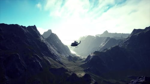 A Helicopter is Flying Over a Mountain Range