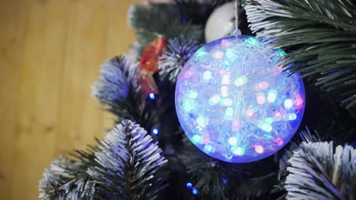 Christmas Tree With Colorful String Lights And Ornaments