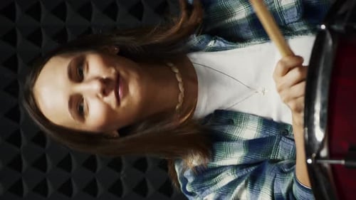 Musician playing drums in professional rehearsal studio. Vertical video