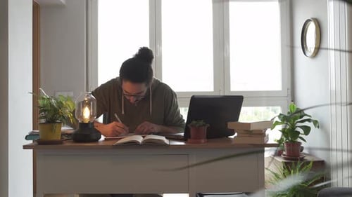 Young Adult Studying in Home Office