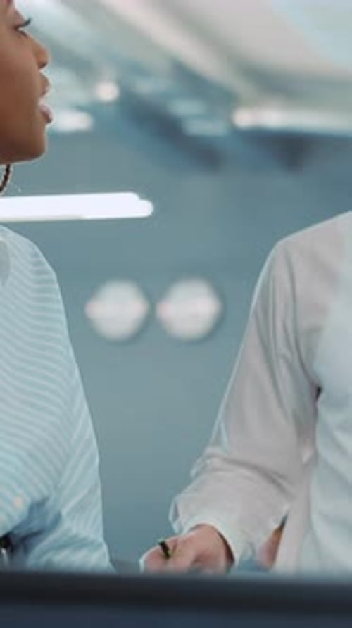 A Dedicated Professional Woman Working in a Modern Office Emphasizing Success and Collaboration