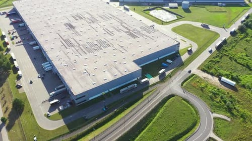 Aerial view of goods warehouse. Logistics center in industrial city zone from above. Aerial view of