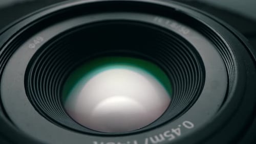 Macro Shot of Professional Camera Lens with Golden Contacts