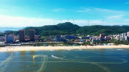 Aerial Top view of a transparent blue sea with beautiful waves at sunny day in summer. air of ocean