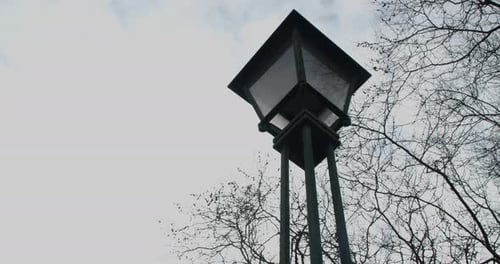 Old Street Lamp in a Cloudy Sky
