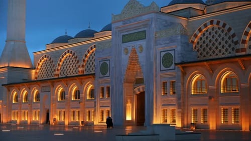 View of the Camlica Mosque in Istanbul at evening, Turkey. Facade made of white stone, illumination,