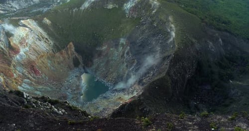 Volcanic Crater and Mountain Ridge in Dramatic Sunset Light