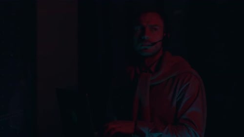 An IT Professional is Currently Working in a Data Center Environment While Using a Headset