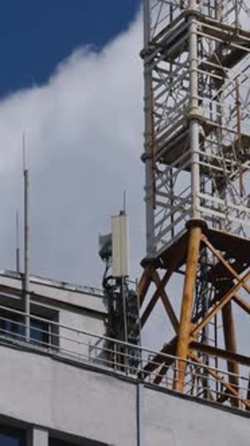 Communication Tower on Blue Sky with White Cloud Background