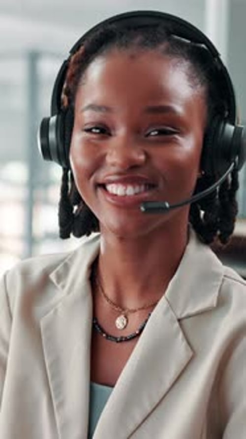 Headset, black woman and face of customer service consultant in office with communication