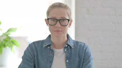 Portrait of Young Woman Looking at the Camera Indoor