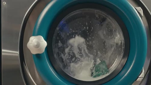 Laundry Machine Washing Clothes Close Up