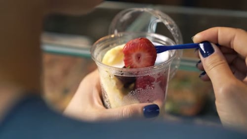 Close Up of Woman Eating Fruits 30s