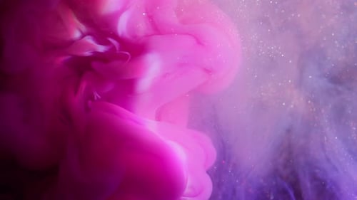 Swirling Purple and Pink Ink with Glittering Particles