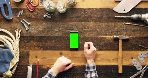 Green screen mockup, construction worker hands with phone for communication