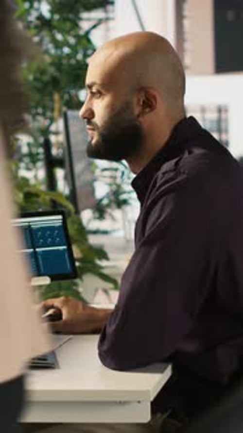 Vertical Video Office Clerk Working to Hit Key Performance Targets for Revenue
