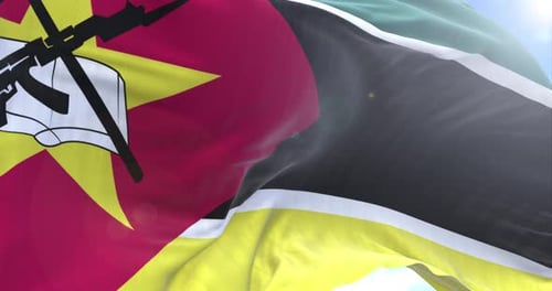 Realistic Mozambique Flag Waving in Blue Sky
