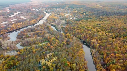 Autumn aerial above river with colorful riverbanks