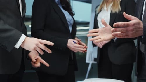 Businesspeople Shaking Hands at Corporate Meeting
