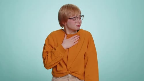 Woman Coughing in Front of Blue Background