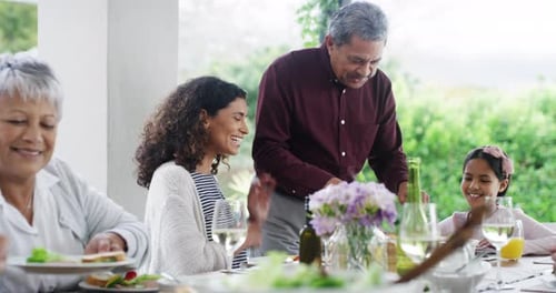 Family Meal Outdoors in Garden Setting