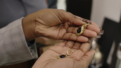 Elegant Gold Earrings Displayed in a Shop