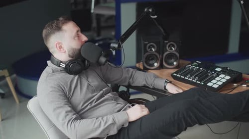 Man Recording a Podcast in Studio Setting