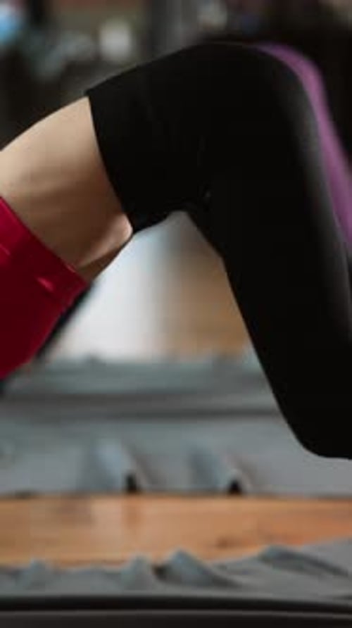 Two Beautiful Girls are Doing Yoga Exercises at Home Stretching Bodies Near Christmas Tree