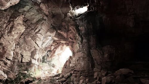 A Cave Filled with Lots of Rocks and Water