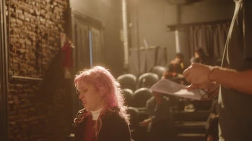 Actors Rehearsing Lines at Table Indoors