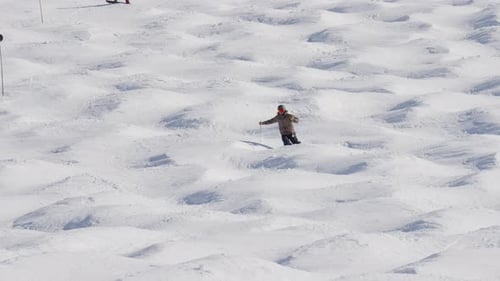 Man Skiing Over Snow Covered Mountain