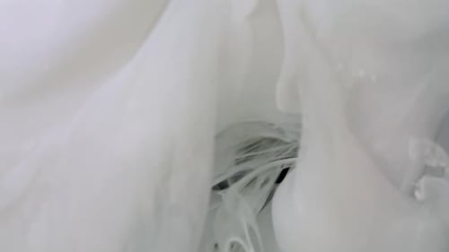 Abstract White Fluid Cloud on Black Background