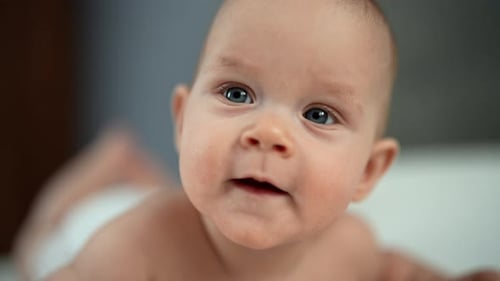 Adorable Baby Smiling in Close-Up Portrait