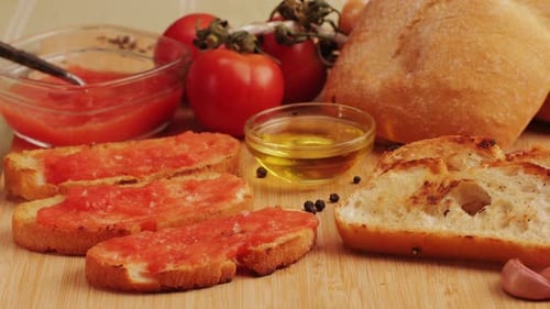 Bread With Tomato, Oil, and Garlic on Board