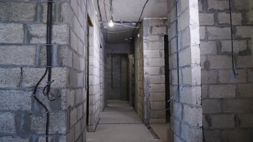 Unfinished Apartment Hallway Construction with Block Walls