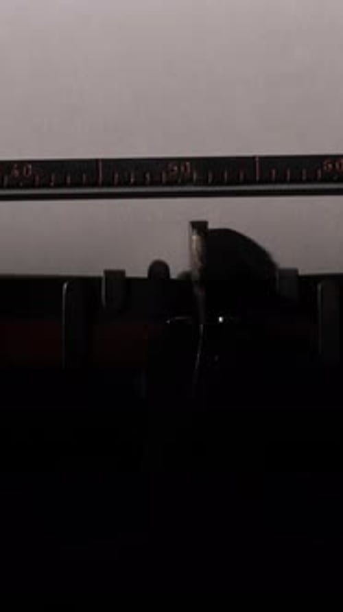 Typewriter Types "Latest News" on White Paper