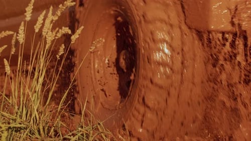 Dirty Suv is Driving at Speed Through Mud and Puddle SUV Rushes Offroad Concept of Offroad SUV