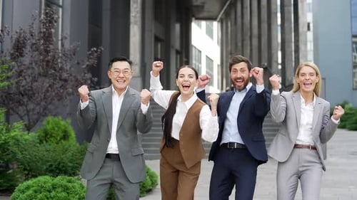 Happy Business Team Celebrating Success Outside Office