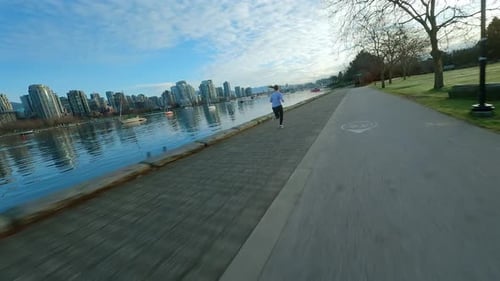 Caucasian Woman Runs Along the Embankment Slow Motion