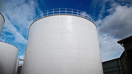 Huge White Storage Tanks in Sunny Industrial Yard