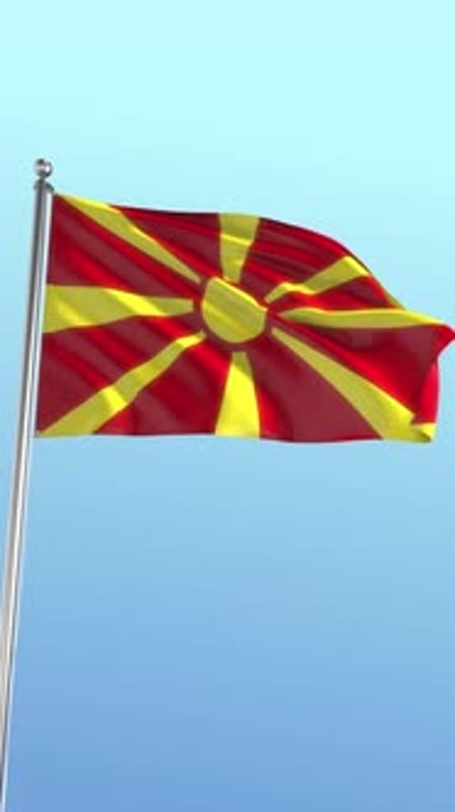 Macedonian Flag Waving Seamlessly Against a Clear Blue Sky