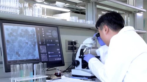 Scientist Using Microscope in Modern Lab