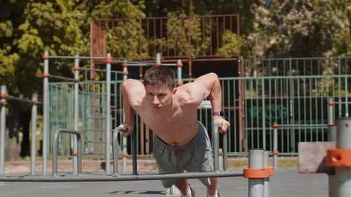 Muscular Man Working Out at Outdoor Park