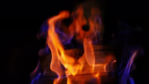 Fire flames in fireplace. Close up shot of warm cozy burning fire in brick fireplace