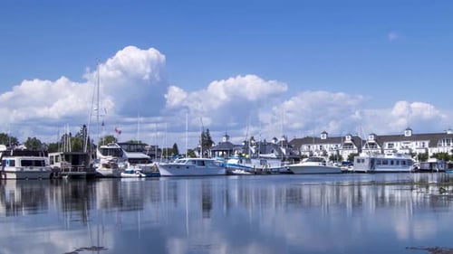 White Clouds Timelapse Over Boats in Marina