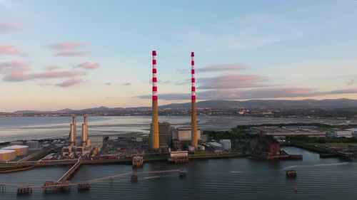 Dublin cityscape with industrial power plant at sunset