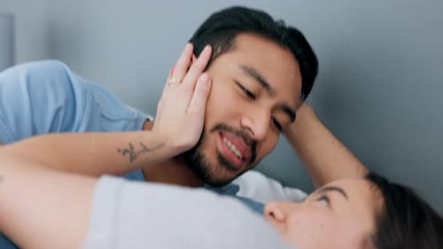 Loving Couple Sharing Intimate Moment in Bed