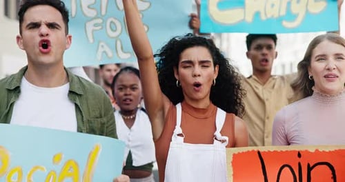 Young Adults Protest with Signs and Megaphone