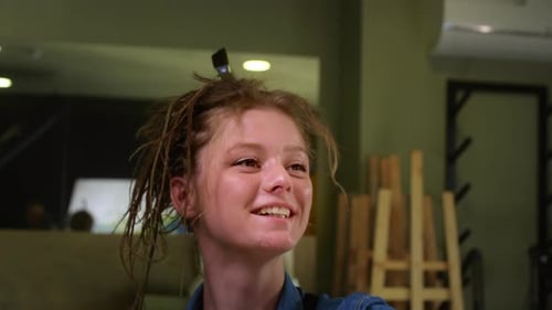 Young Woman Painting in Art Studio