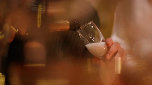 Pouring Sparkling Champagne at an Elegant Celebration